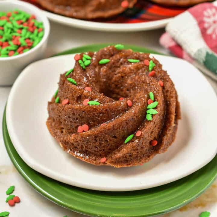 Starbucks Dark Toffee Bundt with berry sprinkles sitting on a white plate.
